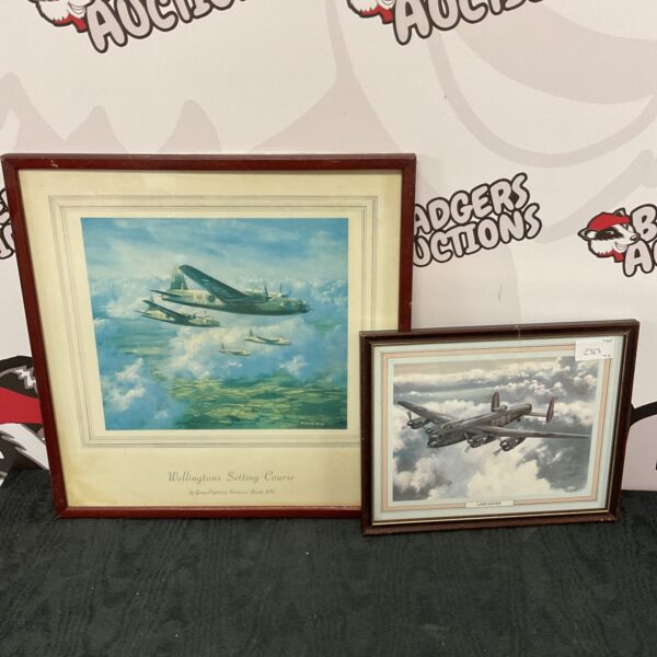 Norman Hoad prints of a Wellington and Lancaster bomber in flight.