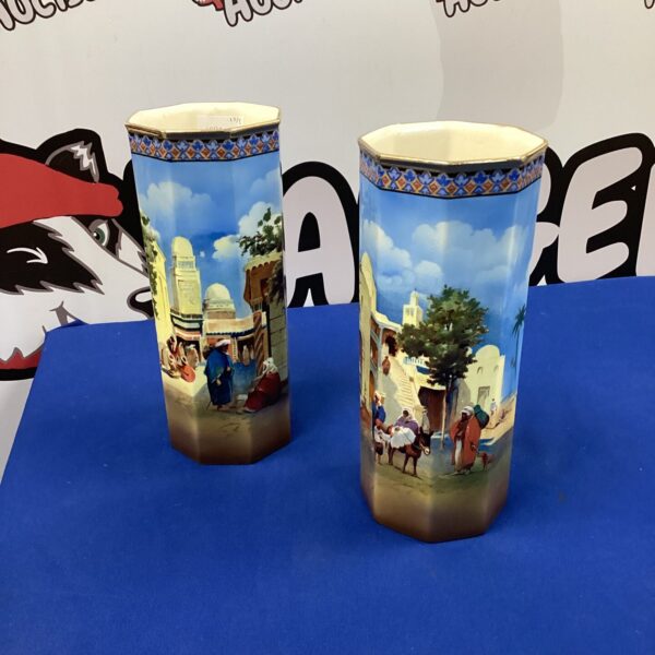 Pair of vintage Falconware ceramic vases with detailed design.
