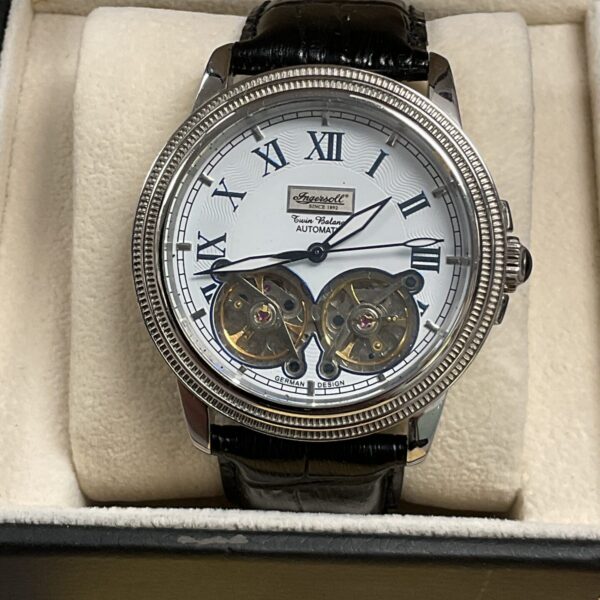 Silver Ingersoll Twin Balance automatic watch with open heart dial.