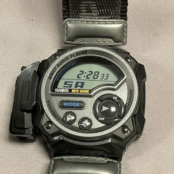 Close-up of the Casio WMP-1V wrist audio player showing the display.
