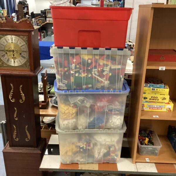 Large boxes filled with a vintage Lego brick collection.