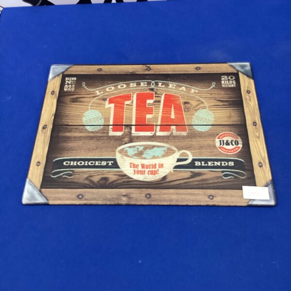 Vintage-style glass chopping board with "Loose Leaf" design.