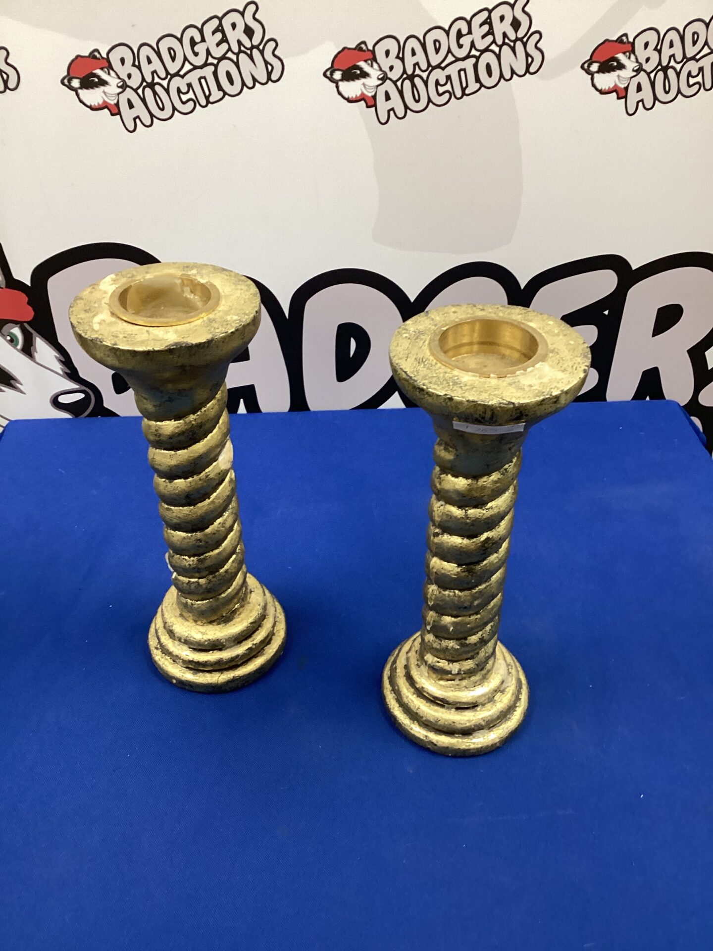 239b Pair of Indonesian wooden gold painted candlesticks