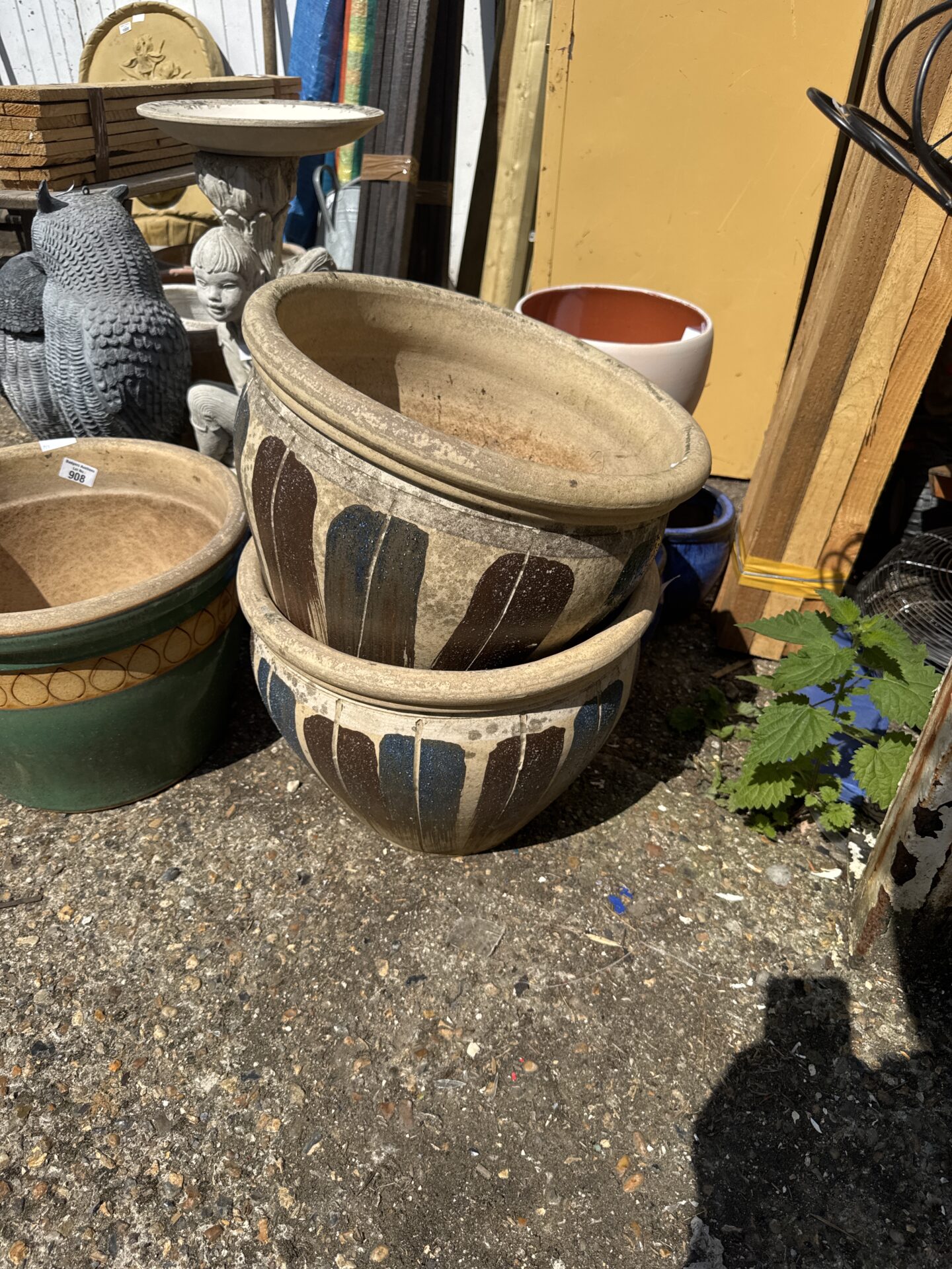 909 Two large terracotta garden pots 15.5” diameter – one has hairline crack