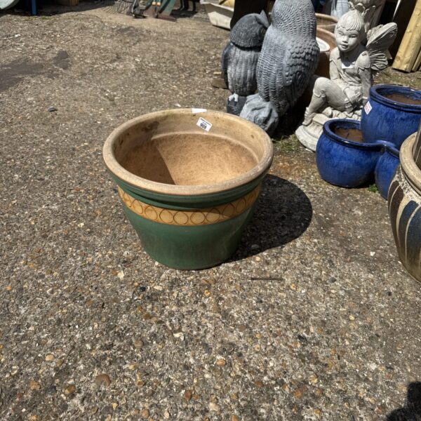Large salt glazed garden pot with weathered texture.