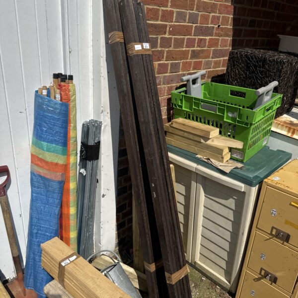 Two bundles of treated timber for garden projects and DIY builds.