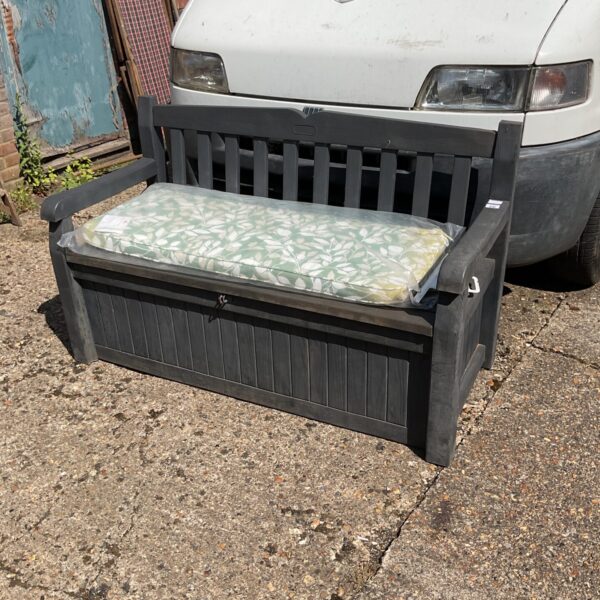 Keter garden storage bench with cushion, ideal for outdoor seating.