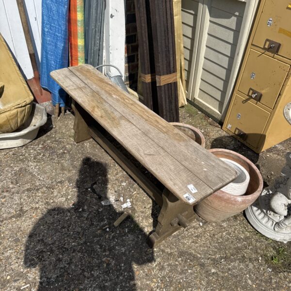 Weathered rustic wooden garden bench for outdoor restoration project.