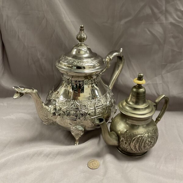 Ornate silver plate and pewter teapot collection, antique tea service.