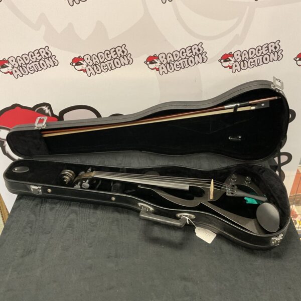 Black electric violin inside a hard case, musical instrument.