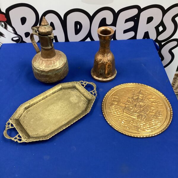Antique copper tray with etched design and warm patina.