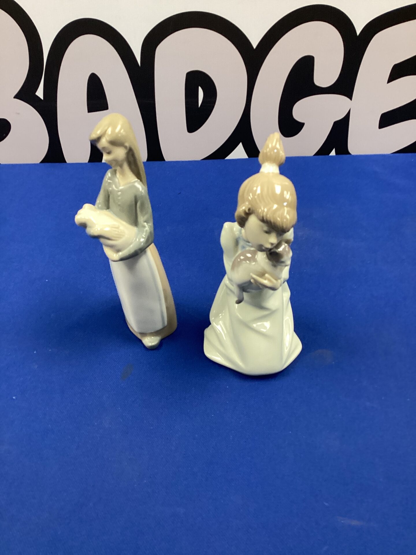 234 Two lladro porcelain figurines inc girl with cat & girl with pig