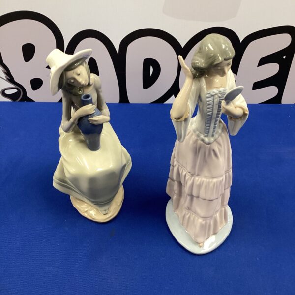 Vintage Lladro Nao porcelain figurines, a girl with a vase and a lady.