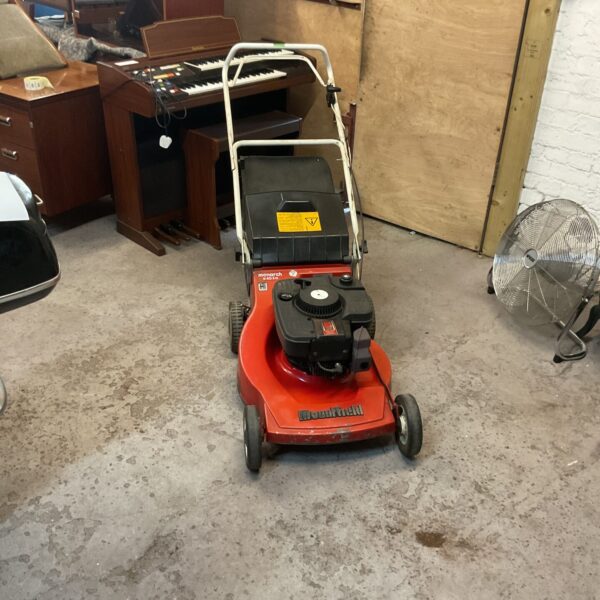 Vintage Mountfield Monarch petrol mower for garden use.
