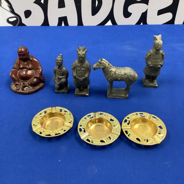 Vintage oriental figurines and ashtrays, collectible ceramic decor.