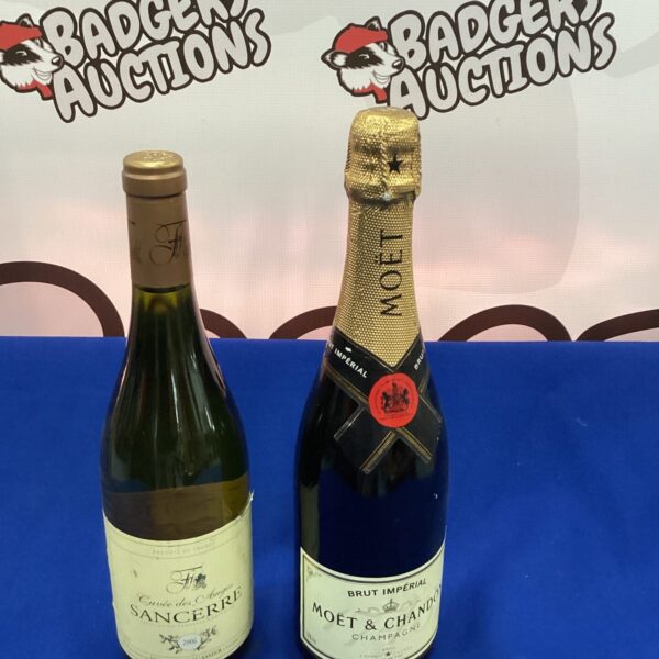 Moet Chandon Champagne and Sancerre wine bottles in a lot.