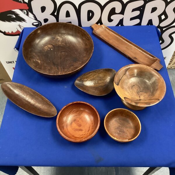 Assorted hand-carved wooden bowls for rustic kitchen decor.