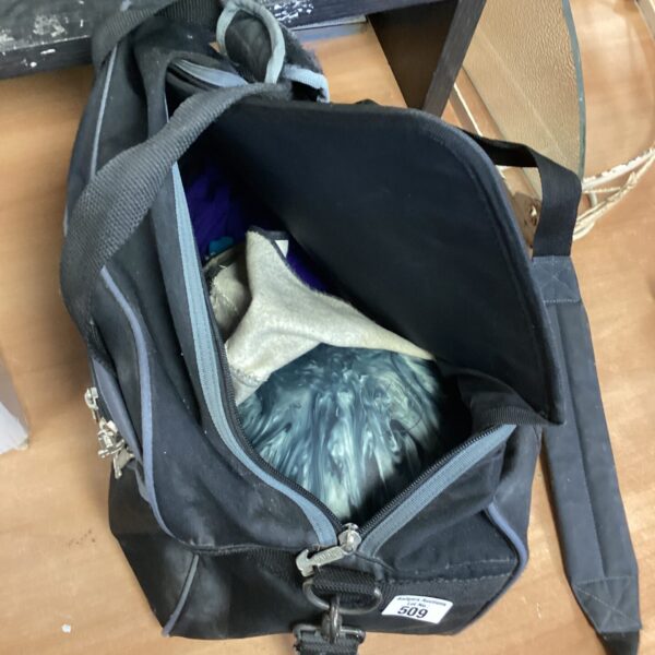 Black bowling ball bag with a bowling ball inside.