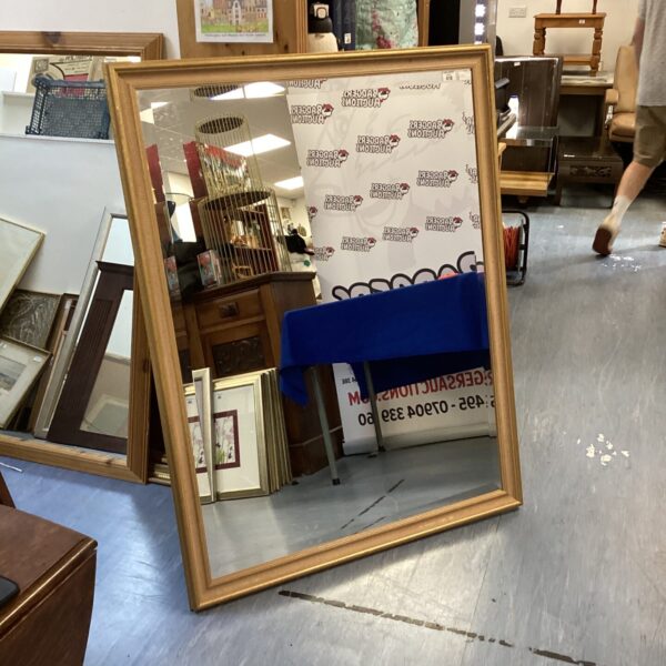 Large bevelled edge mirror with gilt frame, vintage style.