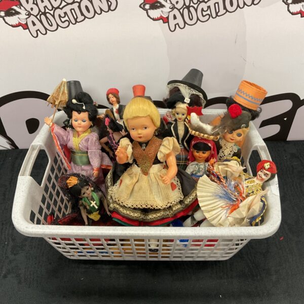 Vintage national dress dolls in a collection, showcasing diverse costumes.