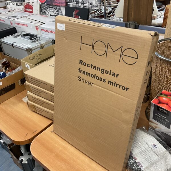 Lot of five new frameless silver mirrors in packaging.
