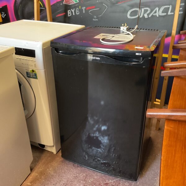 White Russell Hobbs undercounter freezer in a kitchen setting.