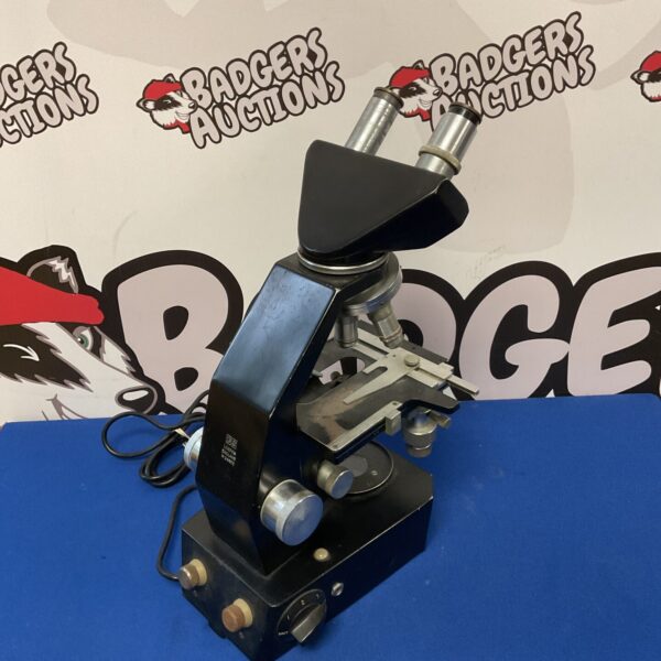 Vintage CS London microscope, a classic scientific instrument.