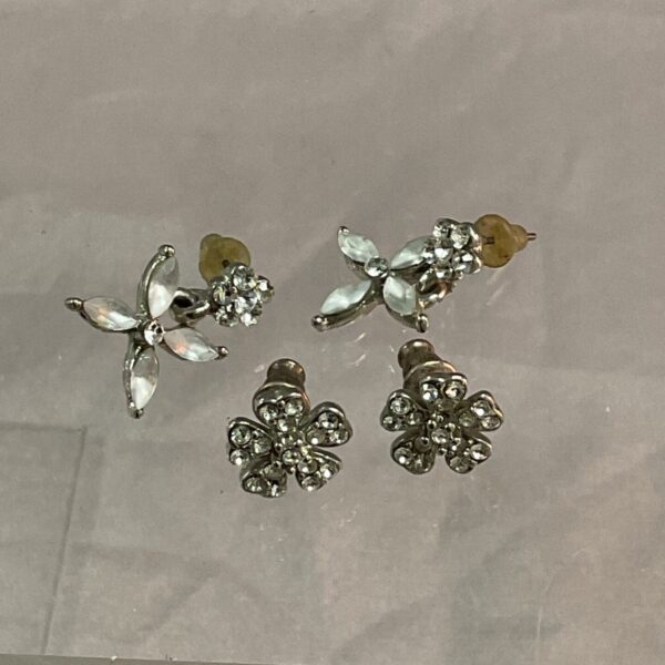 Close-up of vintage art deco earrings with sparkling rhinestones.