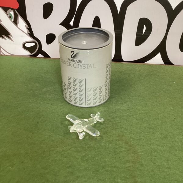 Clear Swarovski crystal airplane with original box, collectible figurine.