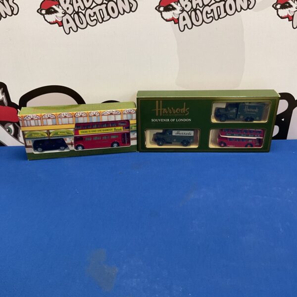 Boxed Harrods London diecast models, collectible souvenir.