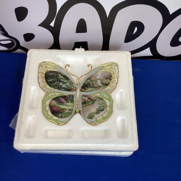 Stillwater Bridge butterfly plaque with landscape wings, decorative wall art.