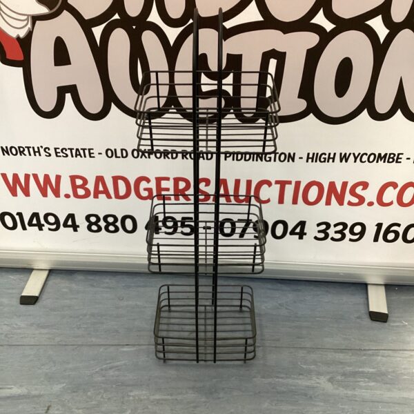 Vintage metal wire vegetable rack for kitchen storage.