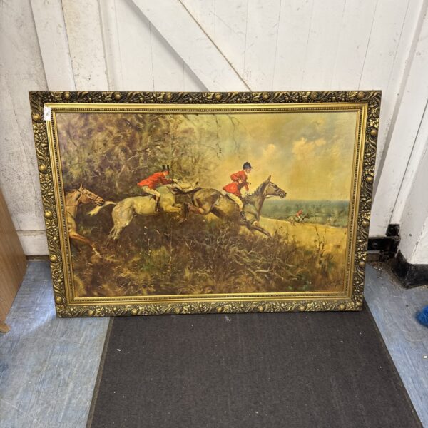 Large gilt framed steeplechase print depicting a horse racing scene.