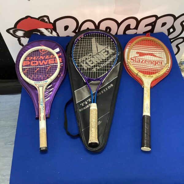 Vintage tennis rackets including a Slazenger Challenge racket on display.
