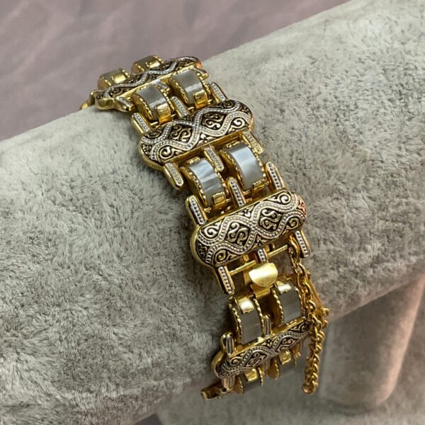 Vintage 1960s Toledo Damascene gold plated bracelet with intricate design.
