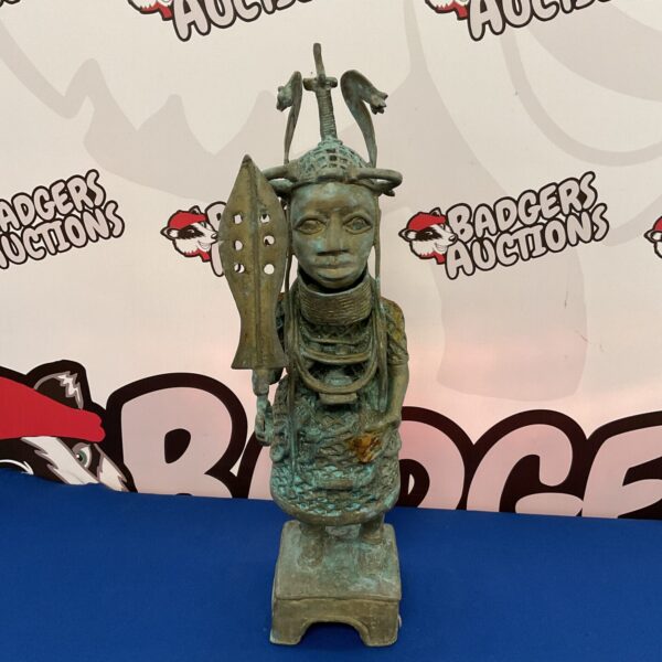 Vintage brass African tribal warrior statue with detailed attire.