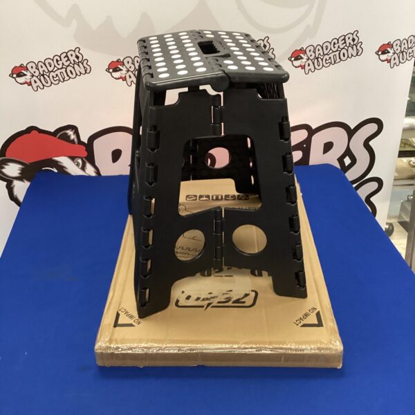 Durable plastic folding step stool for household use.
