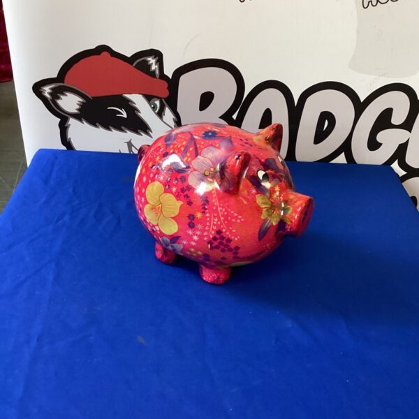 Large colourful ceramic piggy bank for savings and decoration.