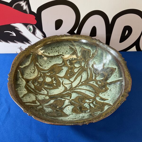 Large studio pottery bowl with green and brown glaze.