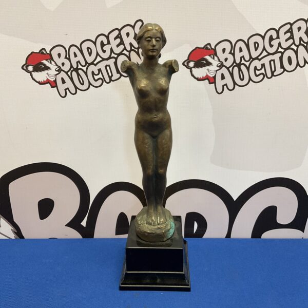 R Schmitz bronze sculpture of a nude female figure.