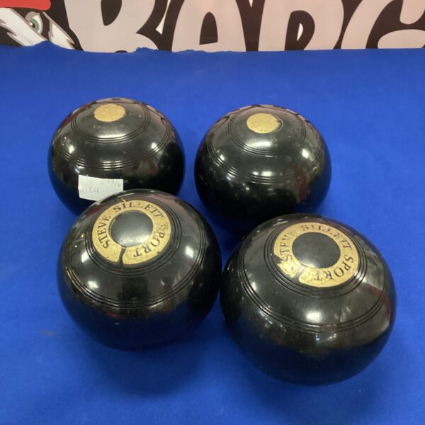 Set of four Steve Sillett lawn bowls for outdoor play.