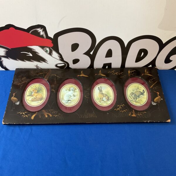Vintage Japanese lacquered photo frame with intricate detailing.