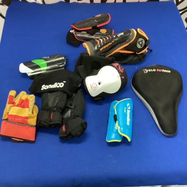 Kids sports gear bundle including shin pads, gloves and cycling saddle.