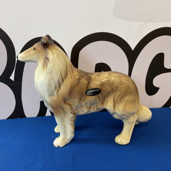 Vintage Coopercraft border collie dog ornament with a chipped foot.