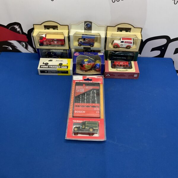 Boxed diecast model collection including Lledo, Bosch, and Cadbury vehicles.