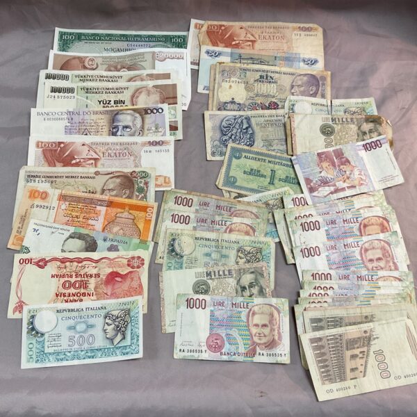 Assorted world banknotes collection, featuring diverse foreign currency.