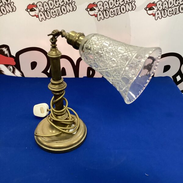 Vintage brass table lamp with frosted glass shade.