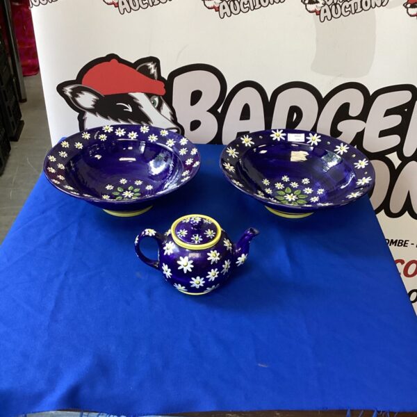 Vintage handpainted ceramic teapot and bowls with floral design.