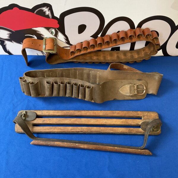 Vintage leather cartridge belts and game carrier, antique shooting accessories.