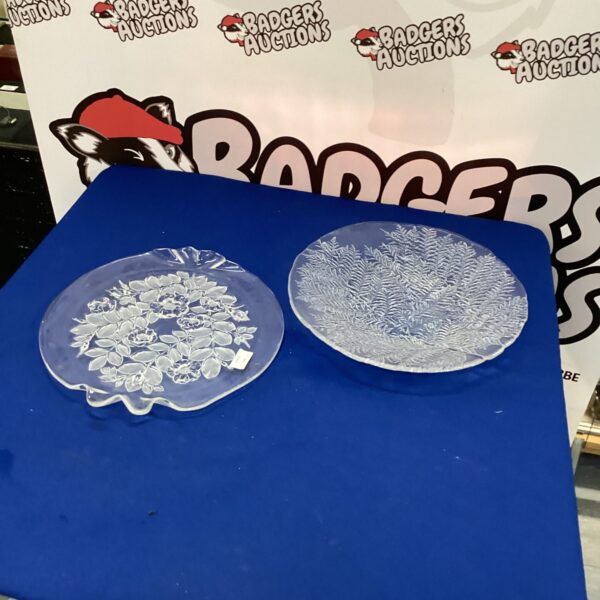 Clear glass platters with embossed floral pattern for serving.